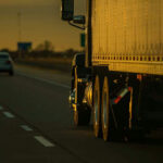 Fuel Blockade CRISIS: Army Placed on Standby… Truck and car driving on highway at sunset.