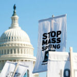 Midnight GOP Mutiny Derails Trump’s SPY Powers… Protest signs against mass spying near the U.S. Capitol.