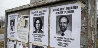 Bulletin board displaying missing person posters for two professionals