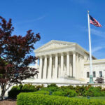 Finally Answers In The Fort Bragg MURDER MYSTERY… Supreme Court building with American flag and trees.