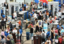 EBOLA FEARS: Atlanta Airport Begins Mandatory Screening… Crowd at an airport security checkpoint with TSA officers.