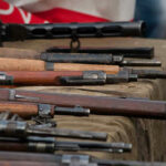Virginia Gun Owners STUNNED by Sweeping Ban… Old rifles displayed on a table