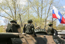 Ukrainian Robots CLASH With Russian Troops! Soldiers on an armored vehicle with a national flag