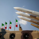 Trump’s Iran DEAL Tease—But Is It Real? Missiles displayed with Iranian flags in the background