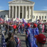 Supreme Court SNUBS Florida – A Shocking Blow! People gathered with flags in front of building