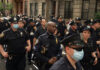 Police officers gathered on a city street