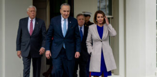 Group of political leaders walking outside the White House