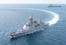 U.S. Fires on Tanker During Iran Blockade Enforcement, Raising Global Tensions Warships maneuvering at sea, leaving a white wake.