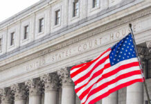 Prosecutors Detail: Behind Bars, But Still in Charge United States courthouse with American flag waving.