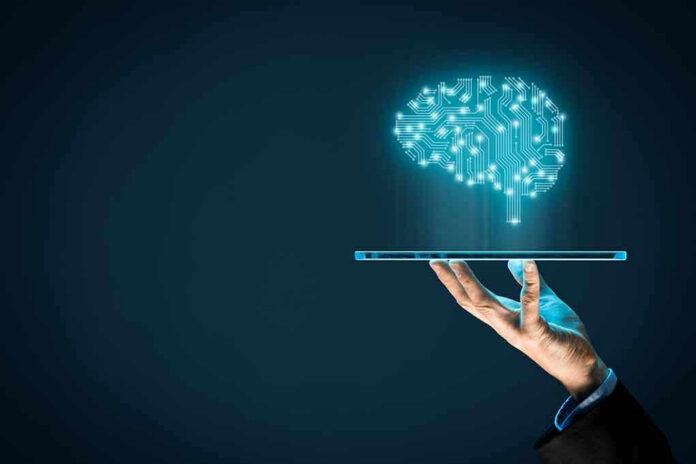 776025448 Digital brain above a hand holding a tablet.