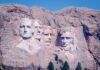 Distant view of Mount Rushmore featuring the carved faces of four U.S. presidents