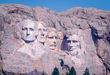 Trump Says America’s Values Are Non-Negotiable Distant view of Mount Rushmore featuring the carved faces of four U.S. presidents