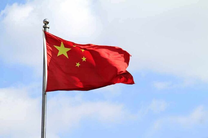 Chinese national flag waving on a flagpole