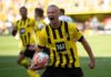 England Waits on Jordan Henderson as Injury Clouds World Cup Final Plans Soccer player in yellow and black jersey celebrating with ball