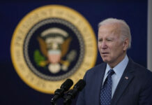 Gala Clip Sparks: Viral Claims Meet Missing Evidence A man speaking in front of presidential seal.