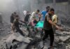 More Than 400 Killed as Pakistan Airstrike Hits Kabul Medical Facility Rescuers carry an injured person on a stretcher through rubble