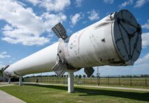 Billions Are Flowing Into SpaceX Falcon 9 first stage booster displayed outdoors on support stands