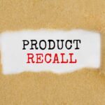 Product Recall text revealed under torn paper