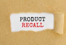 Product Recall text revealed under torn paper